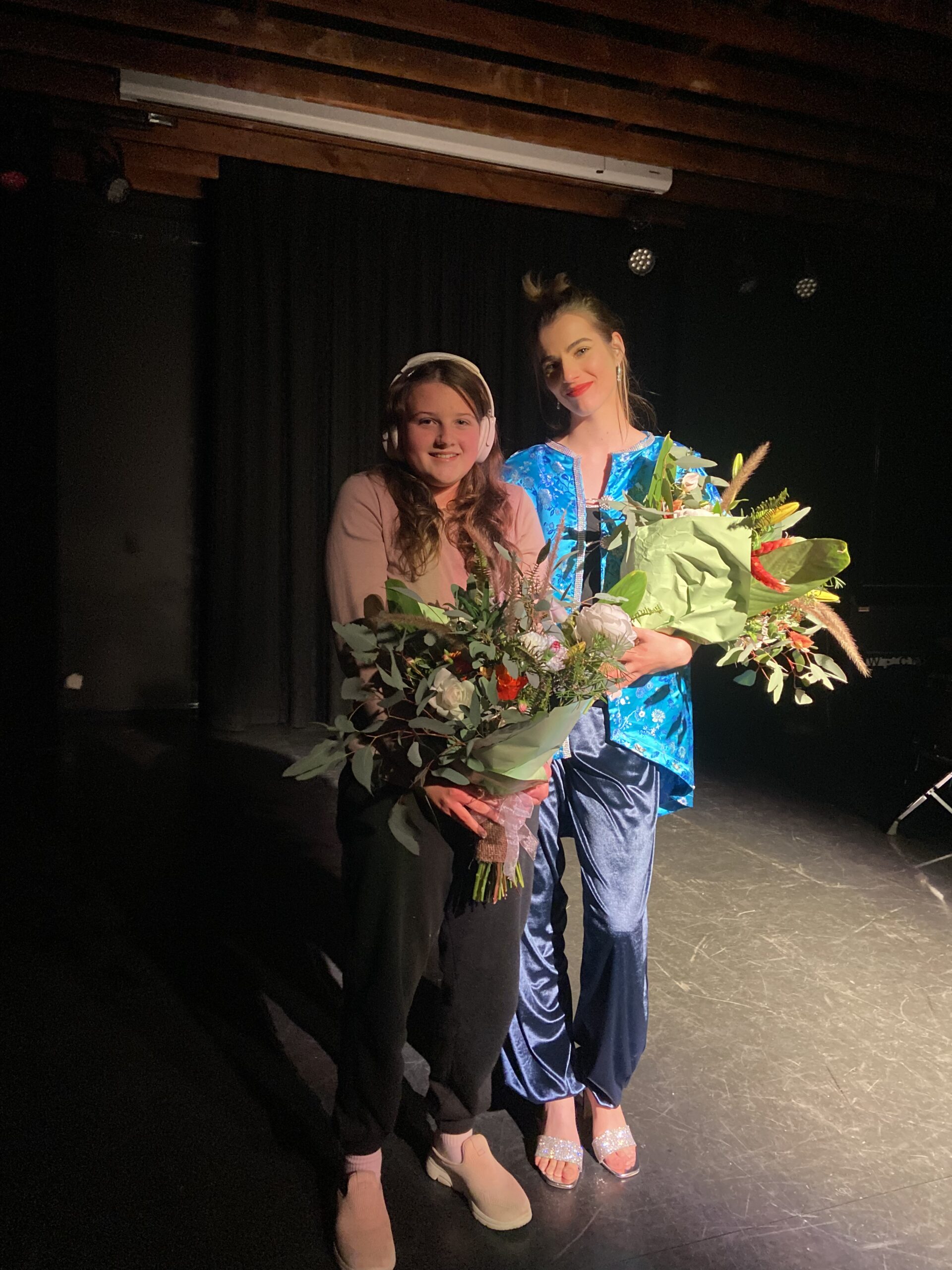 Elsie Designer Elsie (left) with model Olivia holding flowers