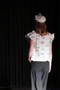 Model wears a pretty Parisian print shirt.