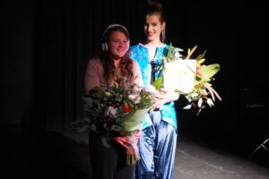 Elsie (left) with model Olivia hold a bunch of flowers.